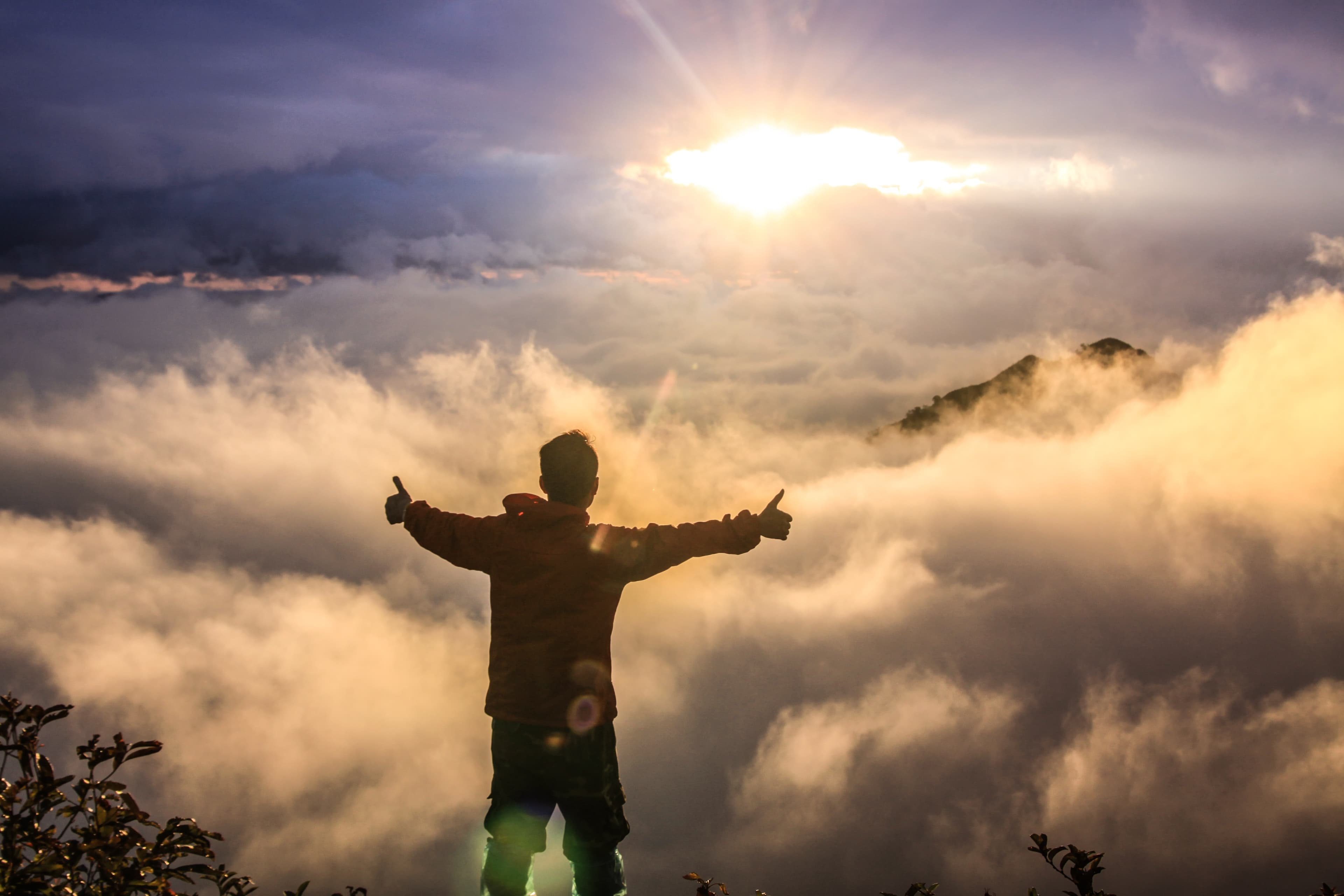 silhouette of a woman celebrating
